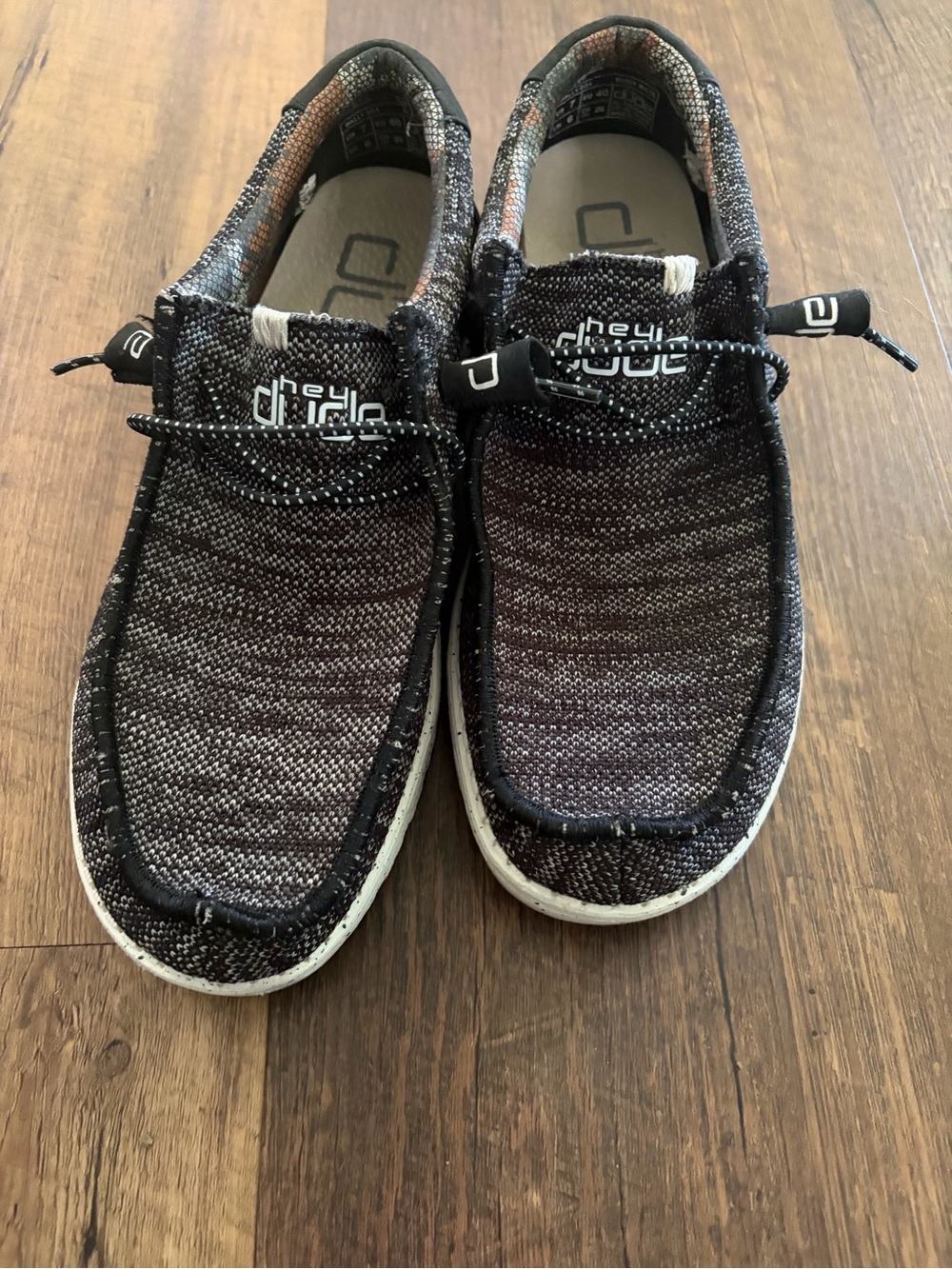 Hey Dude Knit Slip-On Sneakers in Black and white